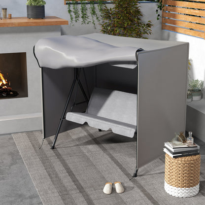 The protective cover partially draped over a garden swing chair on a patio