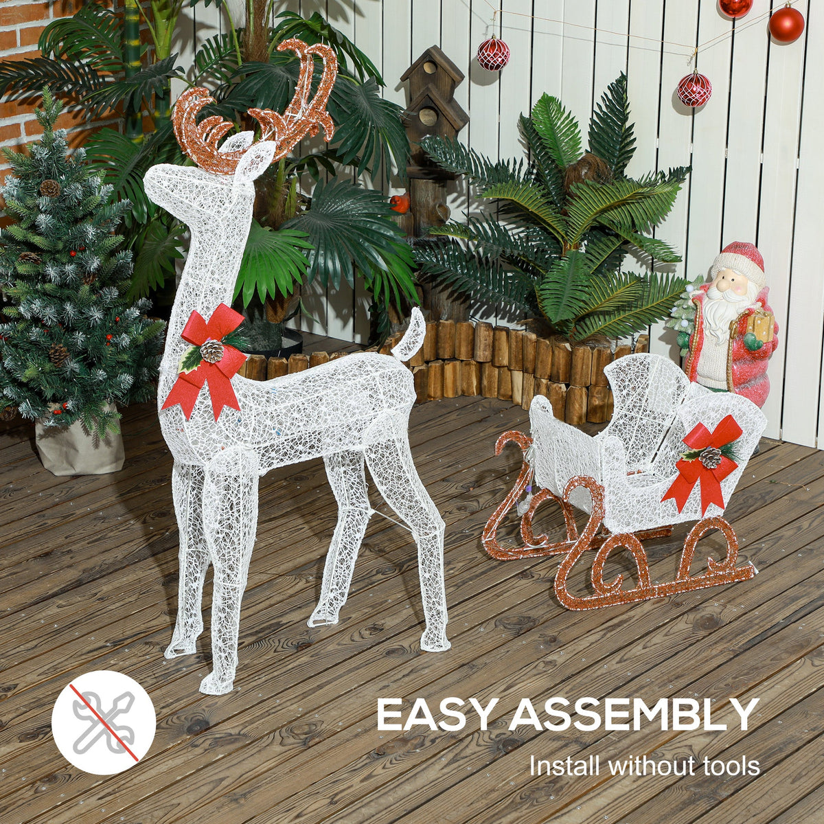 The reindeer and sleigh decoration set up in a garden with Santa figure