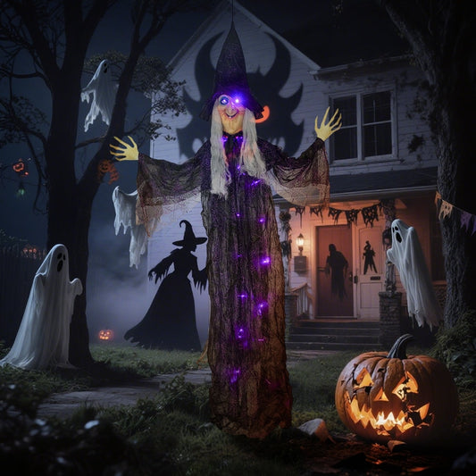 The hanging witch decoration displayed in a spooky garden setting with pumpkins and ghosts