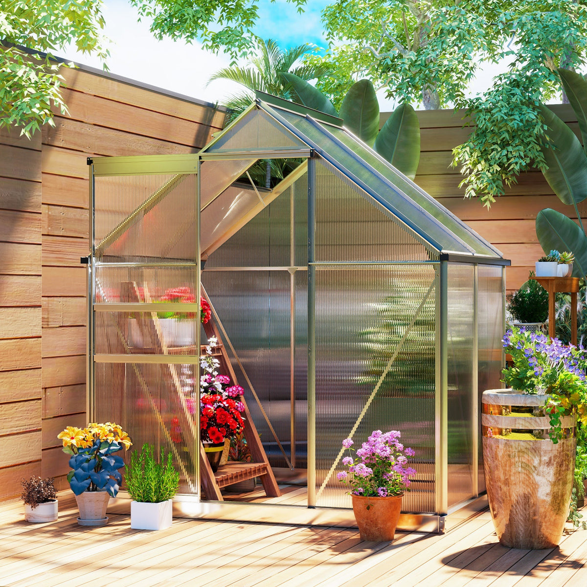 The greenhouse placed on a wooden deck in a garden filled with potted flowers and plants