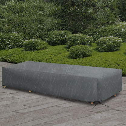 The outdoor garden rattan furniture protective cover shown on a bench in a garden setting with rain falling