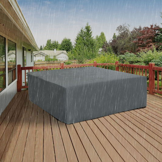 The protective cover placed over garden furniture on a wooden deck during heavy rain