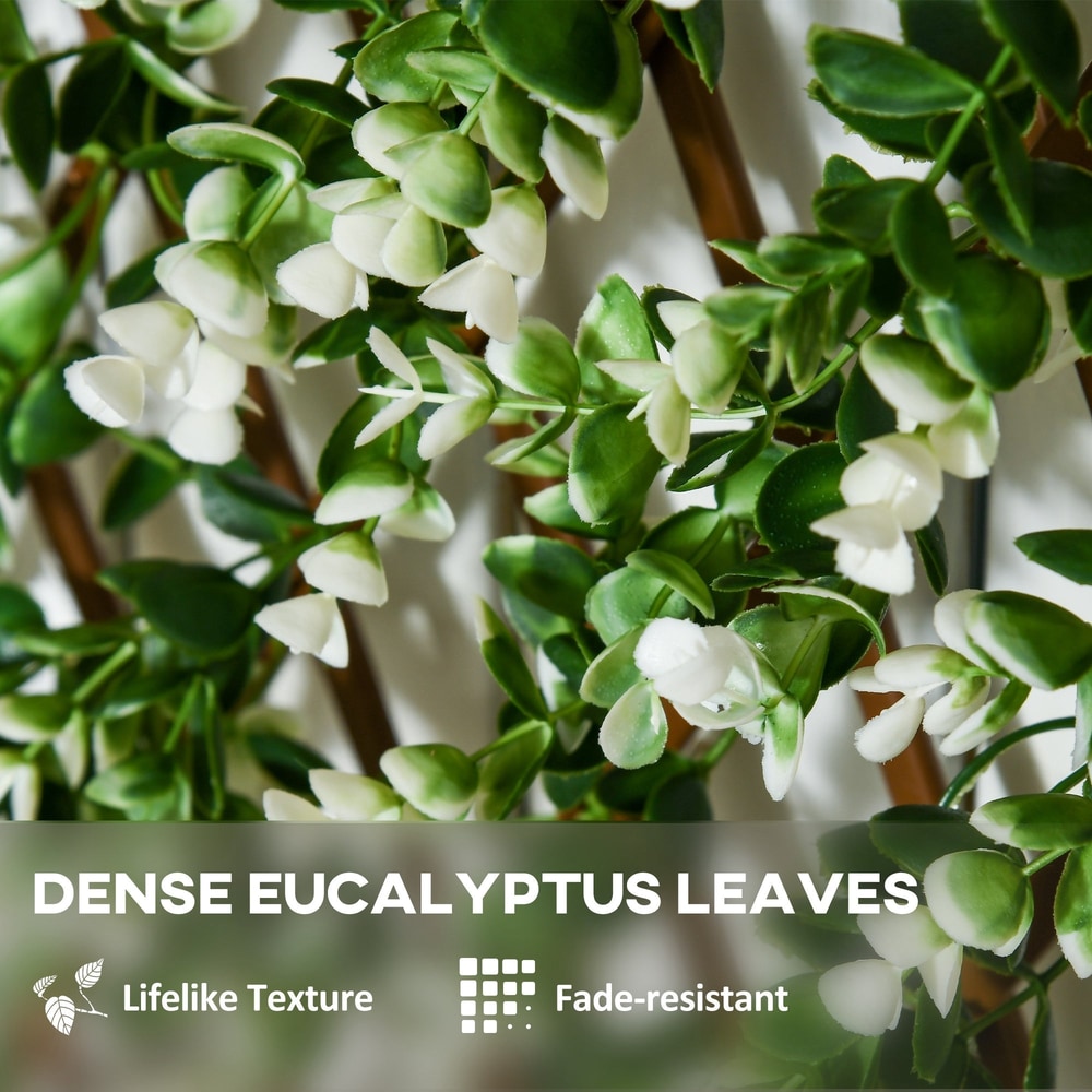 Close-up of the artificial eucalyptus leaves on the expanding garden trellis