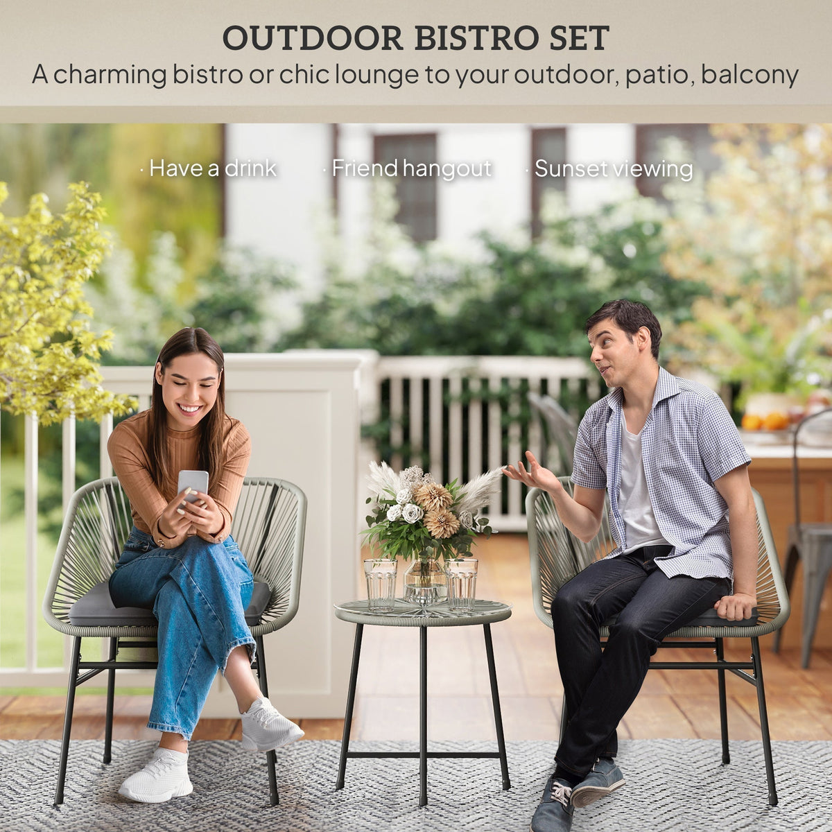 The rattan furniture in use with a man and woman sitting on the chairs on a patio
