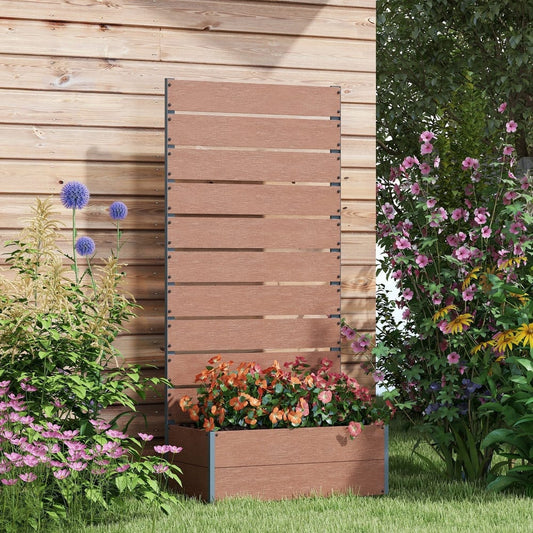 The garden planter box with trellis filled with colourful flowers and set against a wooden fence