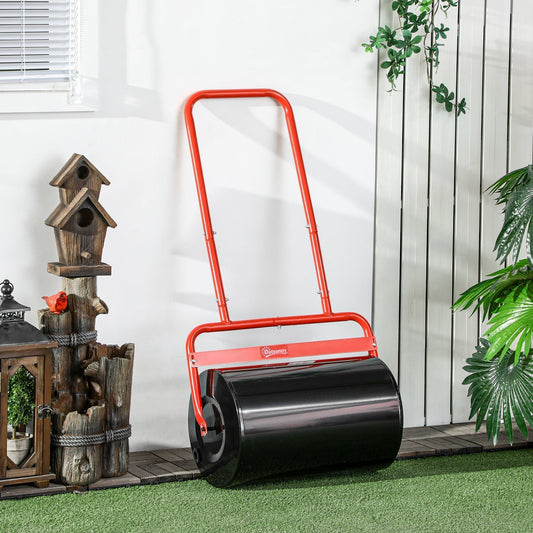 The red and black lawn roller stands against a white wall with plants and birdhouses