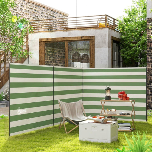 The camping windbreak shelter set up on a patio with chairs and a table