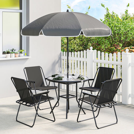 The garden dining set with four chairs and a table with parasol set up on a patio