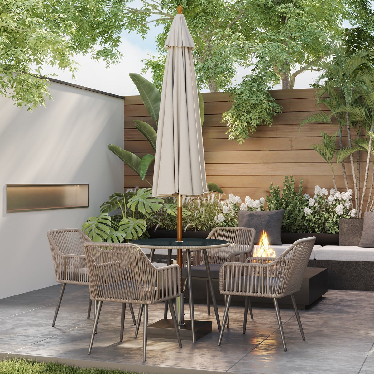 Rattan garden furniture set with parasol hole in a patio setting