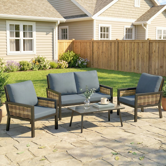 The grey rattan garden furniture set arranged on a patio