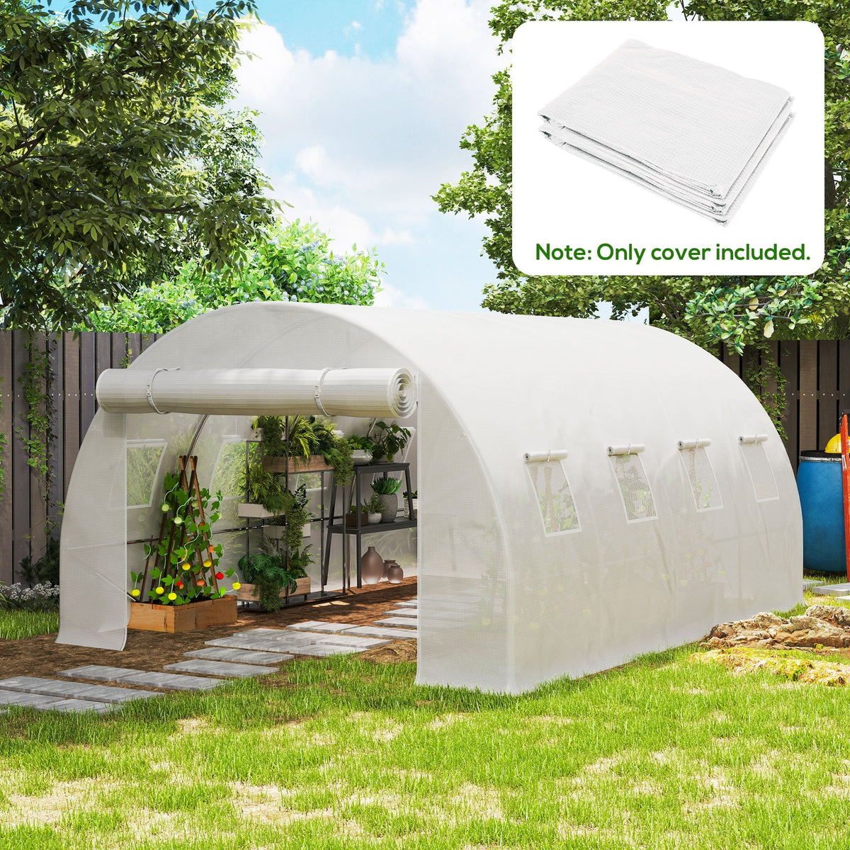 The replacement greenhouse cover installed over a tunnel frame in a garden setting