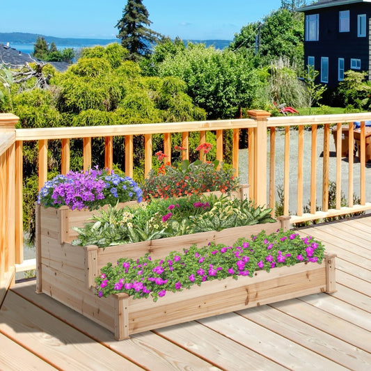 The tiered planter is shown filled with colourful flowers on a wooden deck
