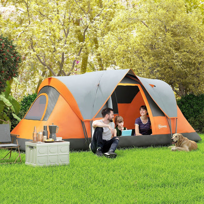 A family and a dog relax inside the orange and grey dome camping tent pitched in a garden