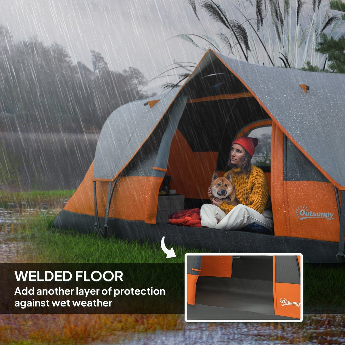 A woman and dog sit inside the orange and grey dome camping tent during light rain, showing the welded floor