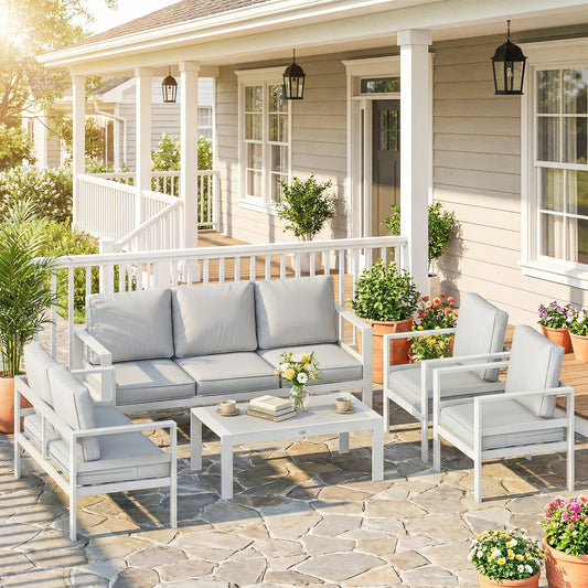 The aluminium garden furniture set arranged on a patio with potted plants