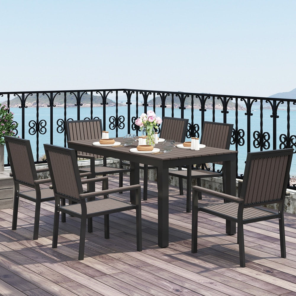 The garden dining set with six chairs around a rectangular table on a balcony