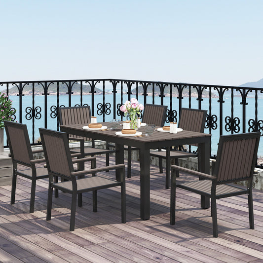 The garden dining set with six chairs around a rectangular table on a balcony
