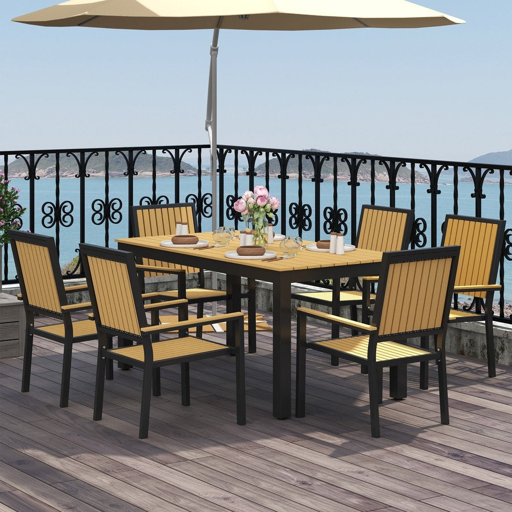 The garden dining set with six chairs around the table on a balcony