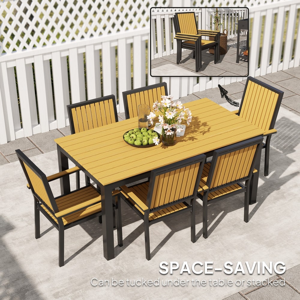 Stackable chairs of the garden dining set tucked under the table