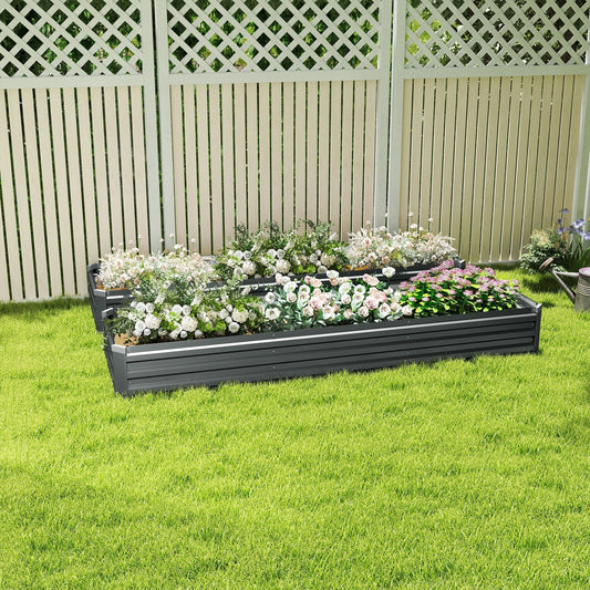 the galvanised raised garden beds positioned on a lawn in front of a white lattice fence