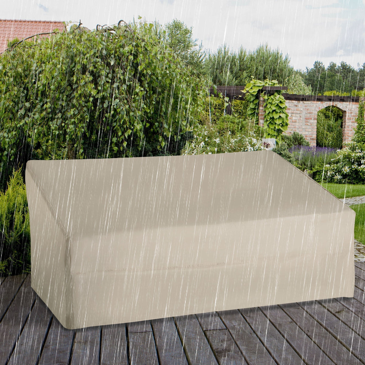 The waterproof garden furniture cover protecting a sofa from rain outdoors