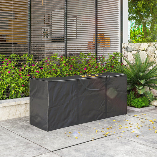 The waterproof garden cushion storage bag in black, shown outdoors on a patio next to plants