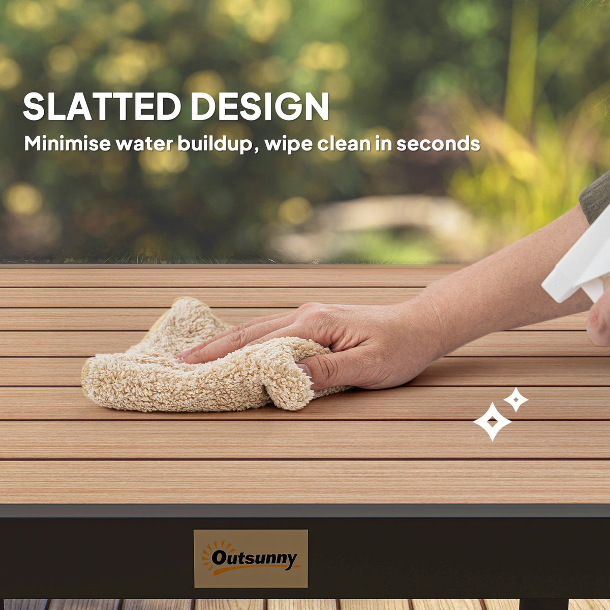 A hand cleaning the slatted top of the garden table with a cloth and spray bottle