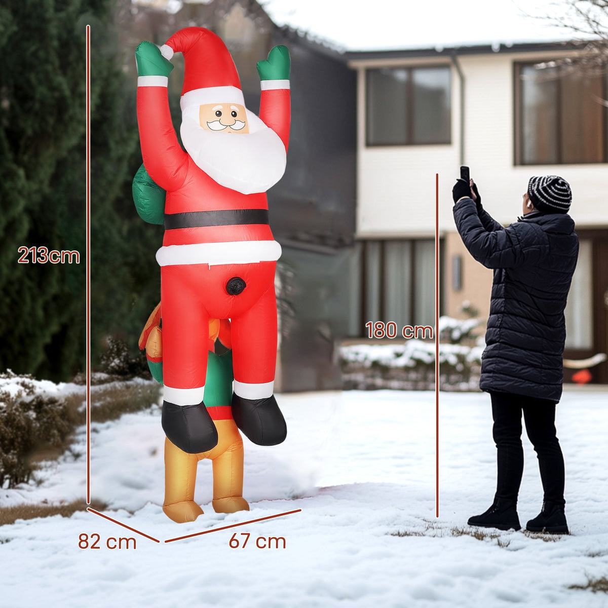 Christmas inflatable Santa with dog, showing scale against a person