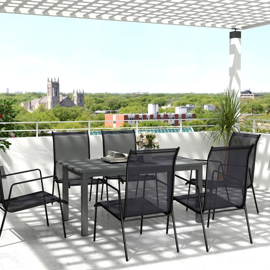 The garden table set up with six chairs on a balcony