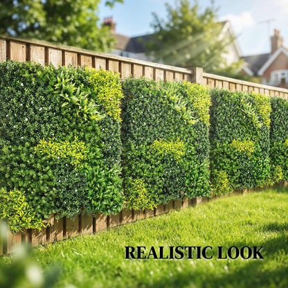 The artificial fence panels attached to a wooden garden fence in a sunny outdoor setting