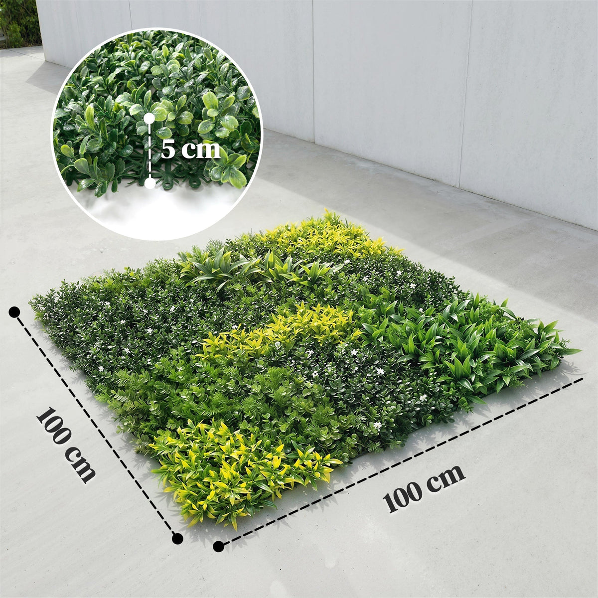The artificial fence panel on a concrete floor with a circular close-up showing leaf detail