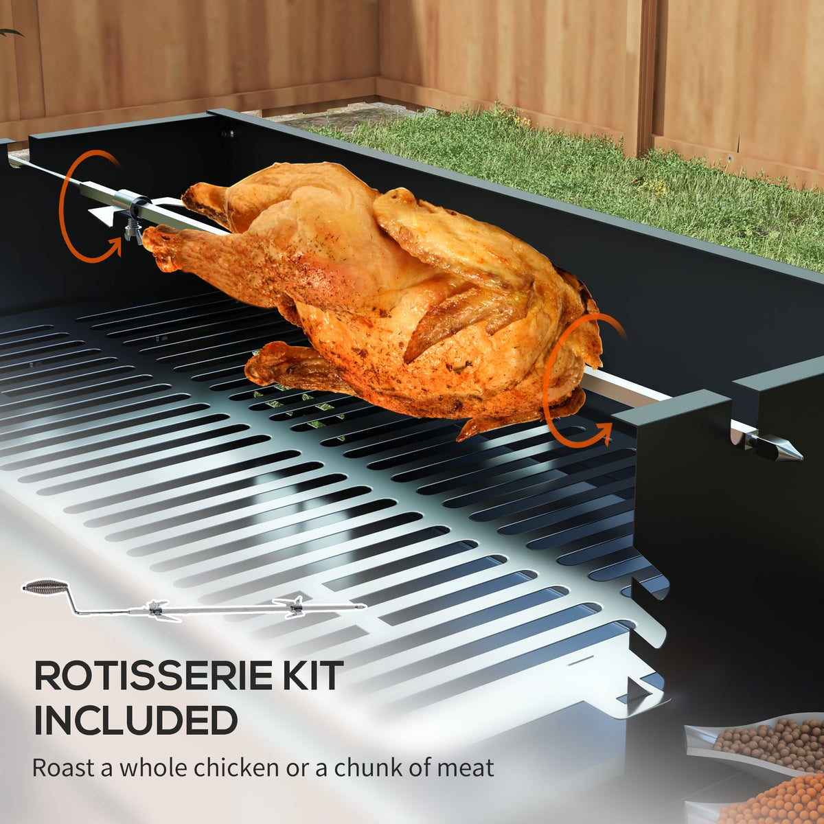 The charcoal grill close up showing the rotisserie spit with a roasted chicken on it