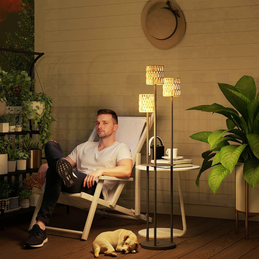 The garden lighting standing next to a man sitting on a deck chair with a dog sleeping nearby