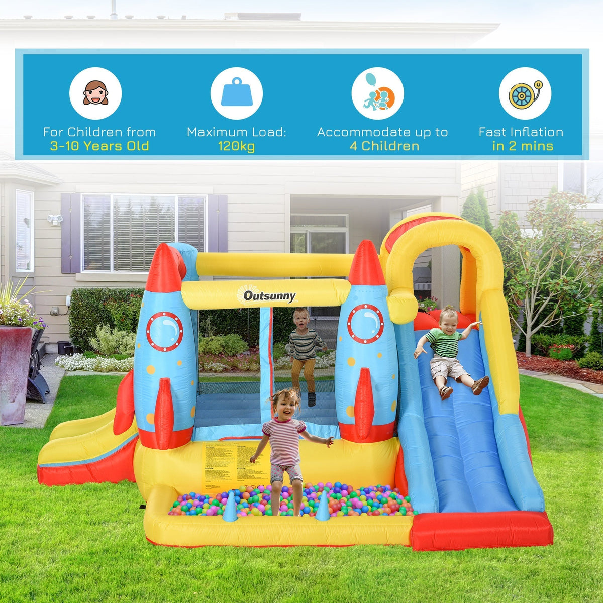 Children playing on the bouncy castle with slides and a ball pit