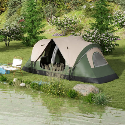 The camping tent set up on a grassy bank by a lake with a folding chair nearby