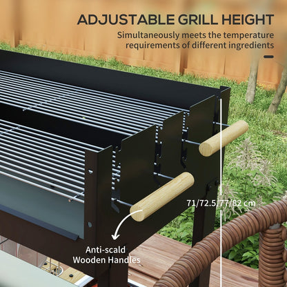 Adjustable grill height on a black trolley charcoal grill with wooden handles