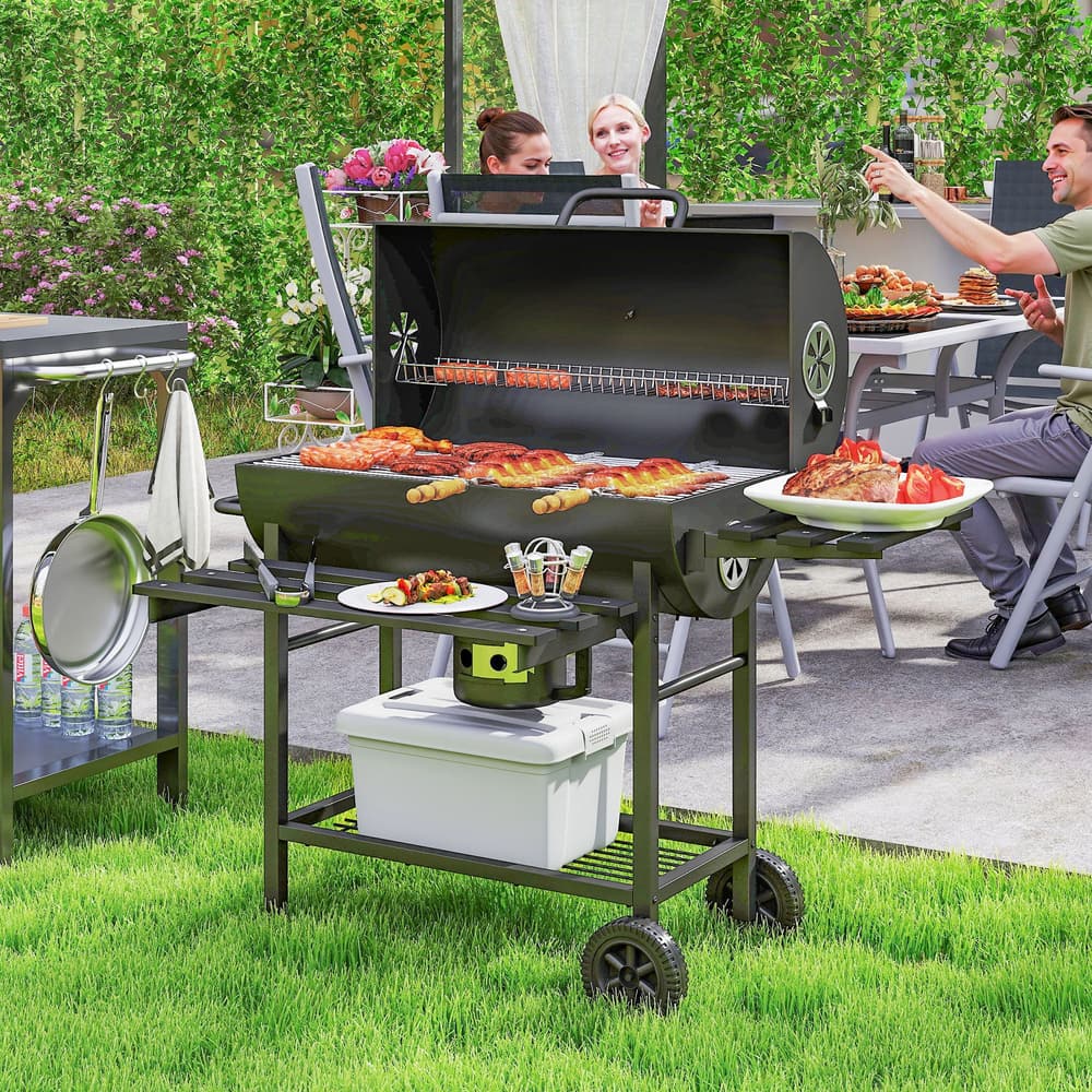 The charcoal grill being used for outdoor cooking with food on the warming rack and main grill