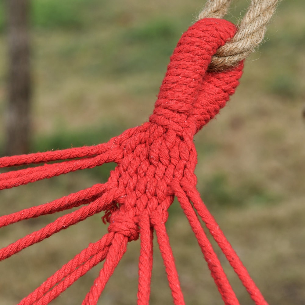 Close up of the red rope loops attaching the hammock to a tree