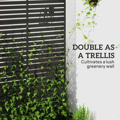 The metal fence covered in climbing green plants to create a lush vertical garden wall