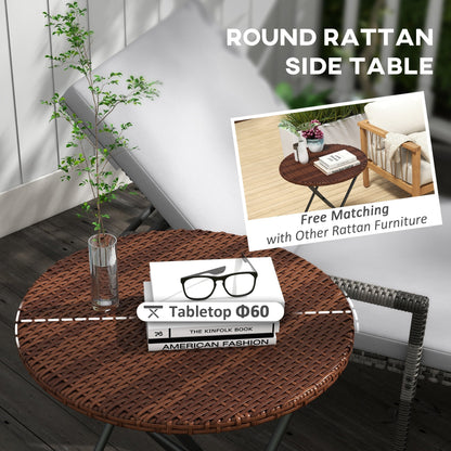 The rattan coffee table top with books and a glass vase placed on a patio setting