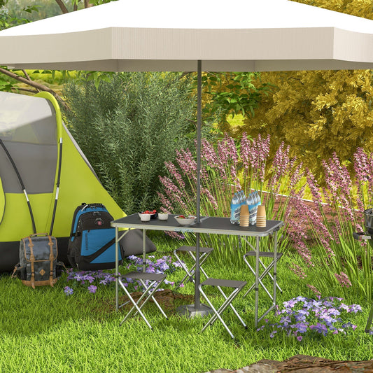 Foldable aluminium picnic set in use outdoors under a large umbrella with a tent nearby