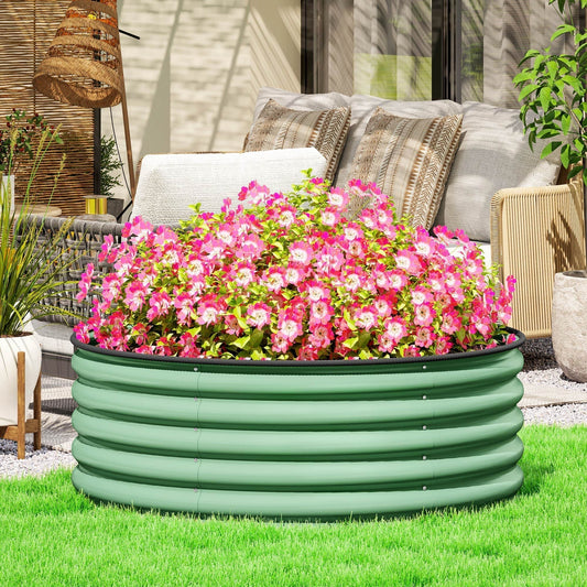 The raised planter box placed on a green lawn in a patio setting with outdoor furniture
