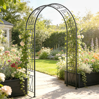 A black metal garden arch with climbing plants, situated on a paved garden path between planters