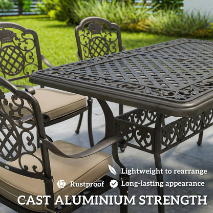 The garden dining set close up showing the intricate metalwork and seat cushions