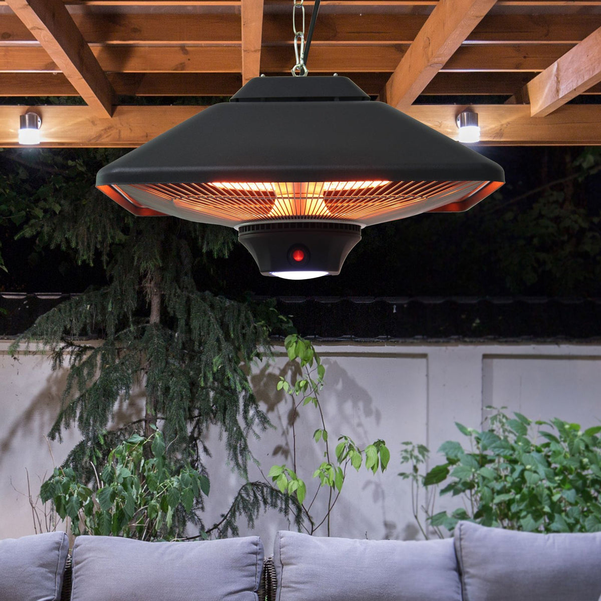 The patio heater suspended from a wooden pergola above a garden seating area at night