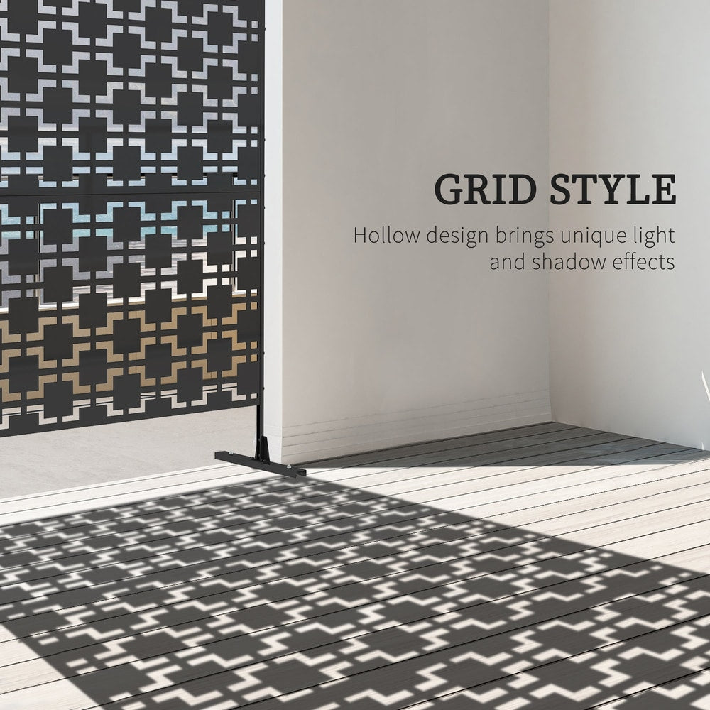 The black metal outdoor divider casting a patterned shadow on a wooden floor