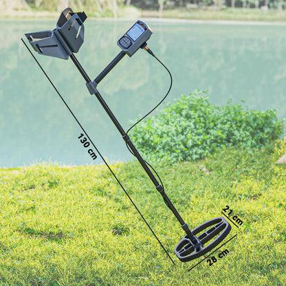 The metal detector standing on a grassy bank by a lake with dimension lines shown