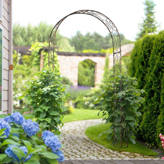 A decorative garden archway with climbing plants on either side, set on a garden path