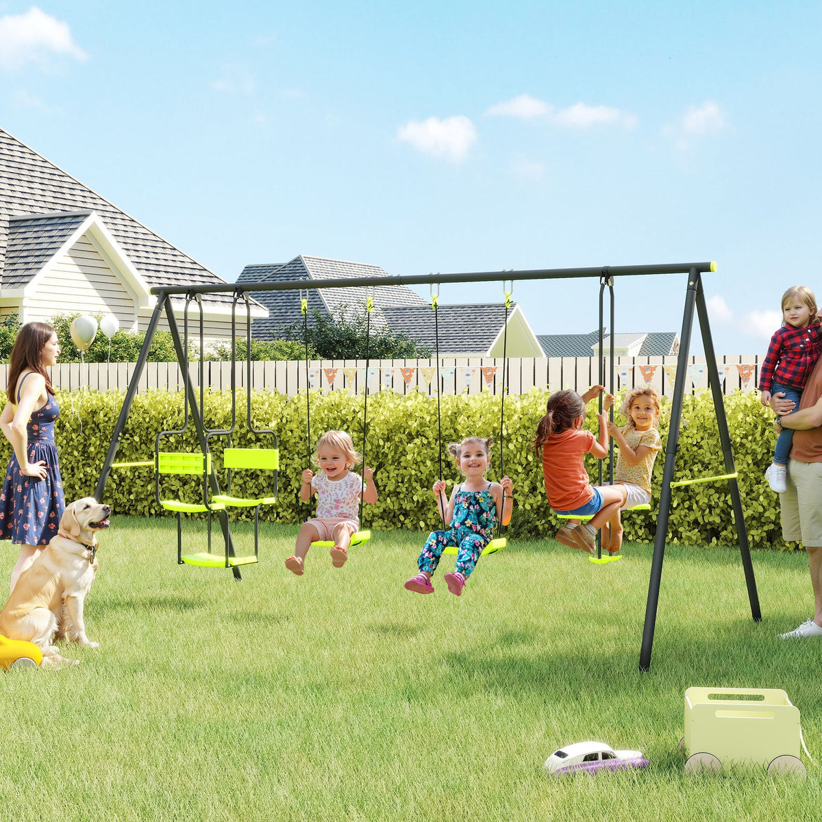 The swing set in use by several children in a sunny garden with a dog nearby