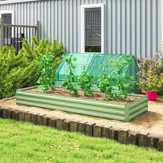 The galvanised raised garden bed filled with plants and covered with a green mesh lid, set in a garden